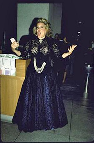 Actress/singer Bette Midler pretending to sing an operatic aria.